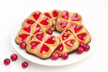 Obraz na płótnie Canvas Sweet cookies with jam and cranberry