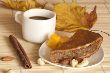 Pumpkin pie served with a cup of coffee