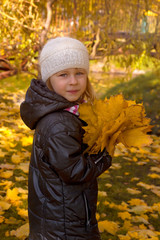 Cute girl in autumn park