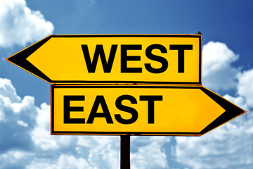 east or west, opposite signs - Powered by Adobe