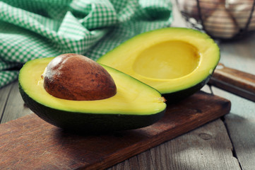 Fresh avocado on cutting board