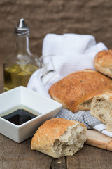 Olive bread rollis in rustic kitchen setting with utensils