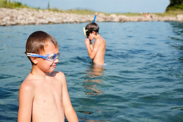 Boys are engaged in in scuba diving