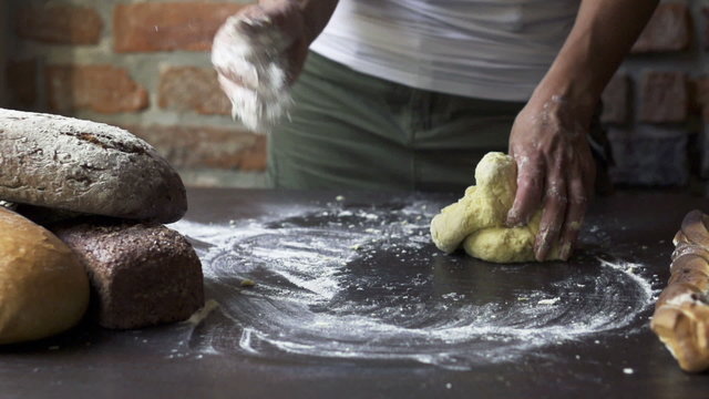 woman kneading the dough, slow motion at 240 fps