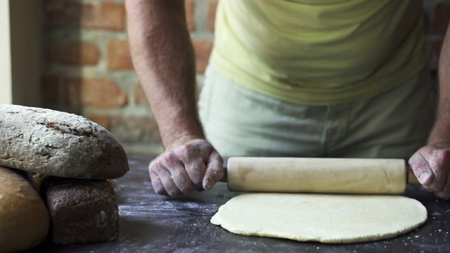 man rolling the dough, slow motion at 240 fps