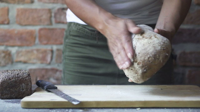 woman touching the loaf of bread, slow motion at 60fps