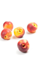 Ripe peaches fruits isolated on white