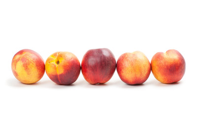 Ripe peaches fruits isolated on white