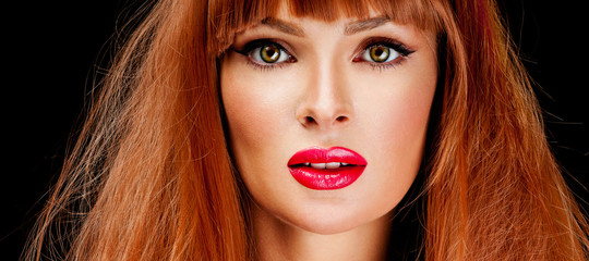 Fototapeta premium Red Hair. Fashion Girl Portrait. long Hair and red lipstick.