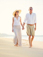 Middle Aged Couple Enjoying Walk on the Beach