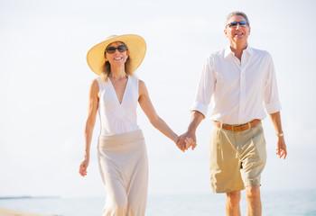 Middle Aged Couple Enjoying Walk on the Beach