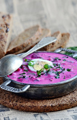 Russian Okroshka soup with bread closeup