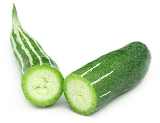 Sliced Snake gourd over white background