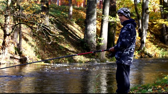 Boy fishing near river in autumn episode 10