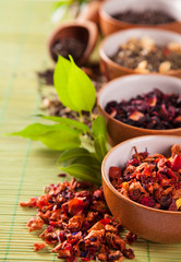 Various dry tea in small bowls