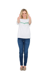 Smiling blonde volunteer giving thumbs up to camera