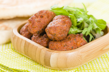 Koftas - Asian style meatballs served with salad and pita bread.