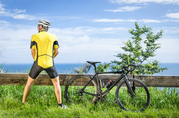 Cyclist peeing in the bushes during a Race