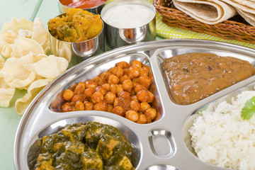 Thali - Vegetarian curries and rice in a traditional dish - obrazy, fototapety, plakaty