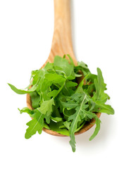 rucola in a wooden spoon