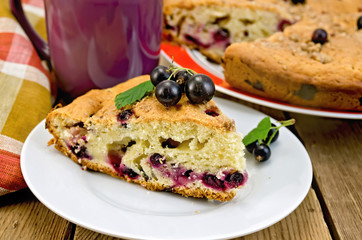 Pie with black currant on the board