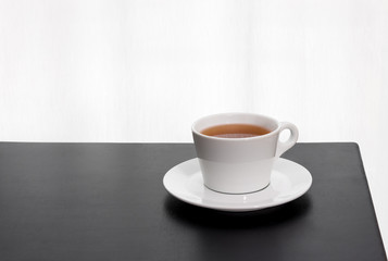 Cup of tea on a black table