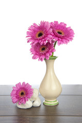 Pink Gerbera in vase and white rocks - 57197224