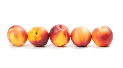Ripe peaches fruits isolated on white