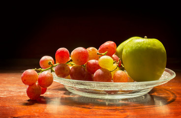 Still life grape and apple on dish