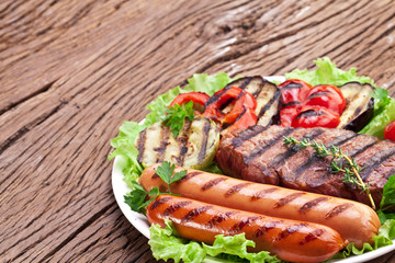 Grilled steak,sausages and vegetables.