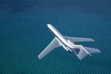 airplane flies over a sea