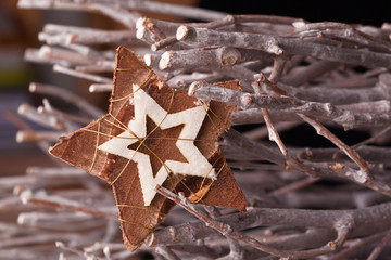 christmas star decoration with wooden branches