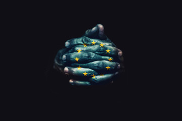 Crossed hands with European Union flag