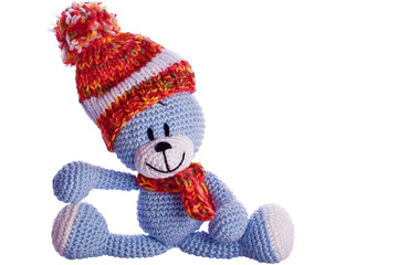 teddy bear with  scarf and bobble cap in winter