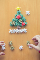 Female hands making Christmas decorations
