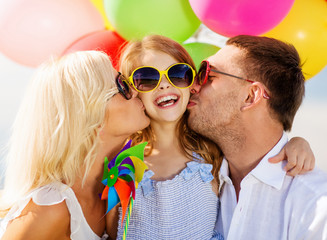 family with colorful balloons