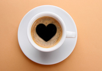 Cup of fresh coffee with heart sign