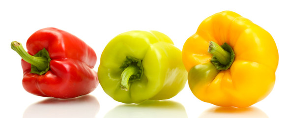 fresh yellow, red and green bell peppers isolated on white