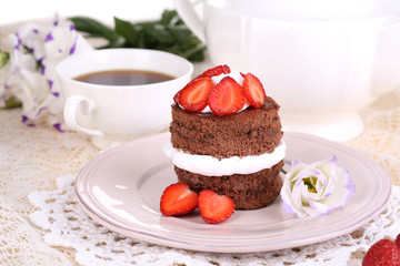 Chocolate cake with strawberry on table close-up