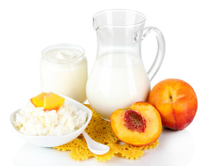 Fresh dairy products with peaches isolated on white