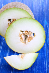 Ripe melons on wooden table close-up
