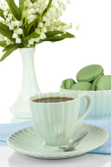 Coffee and macaroons isolated on white
