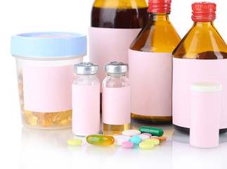 Pills and medicine bottles isolated on white