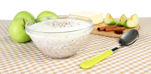 Buckwheat porridge with milk on table on white background