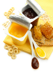 Tasty desserts in open plastic cups and honey combs, fruits,