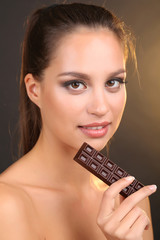 Portrait of beautiful young girl with chocolate