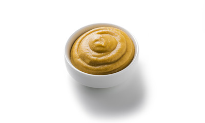 mustard sauceboat on a white background