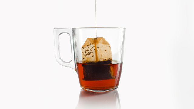 red teabag in a crystal cup