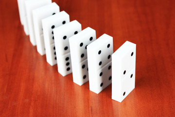 Dominoes on wooden background