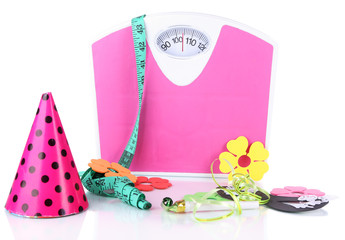 Scales and holiday attributes isolated on white